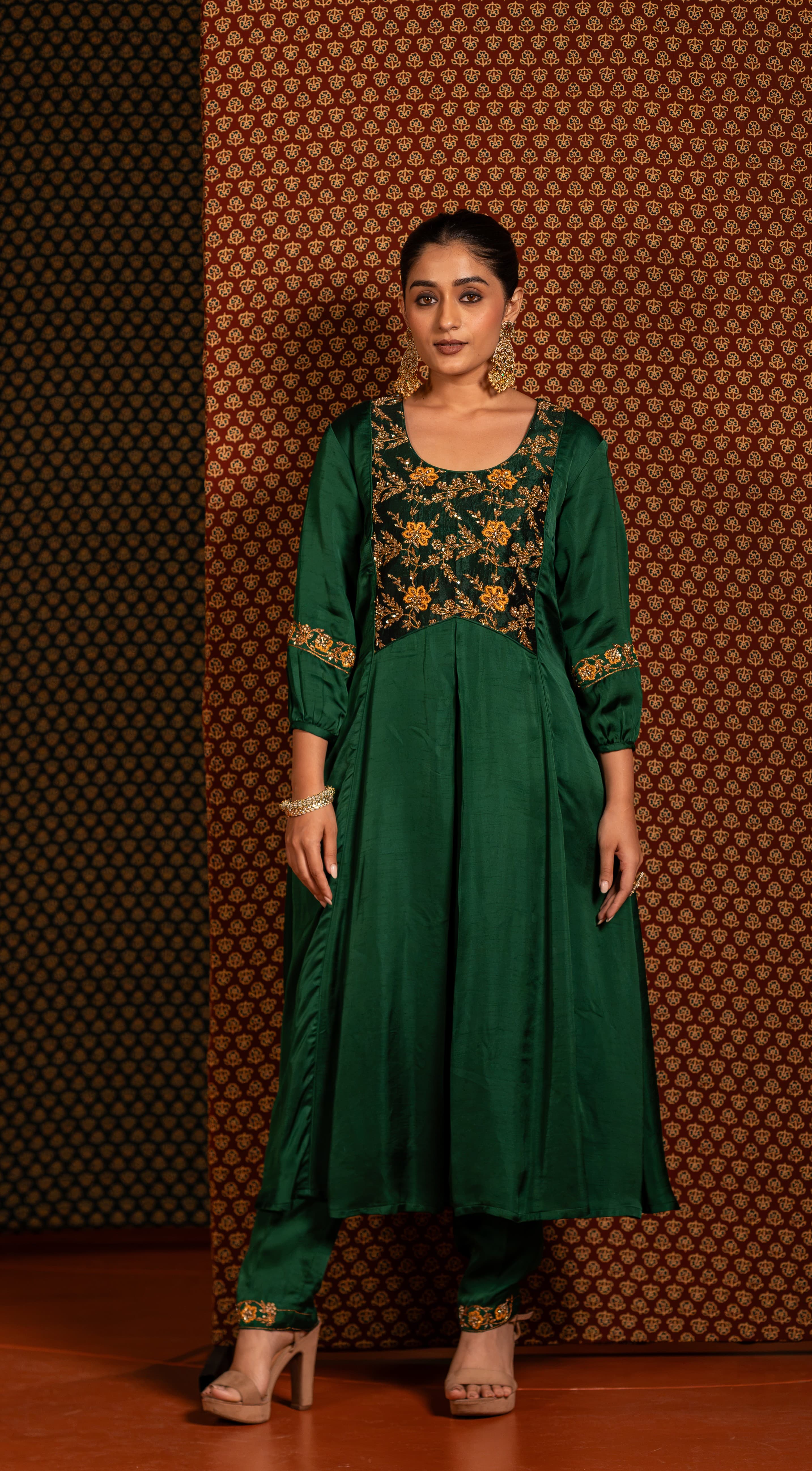 Green Aline kurta set with intricate handwork featuring vibrant yellow floral motifs