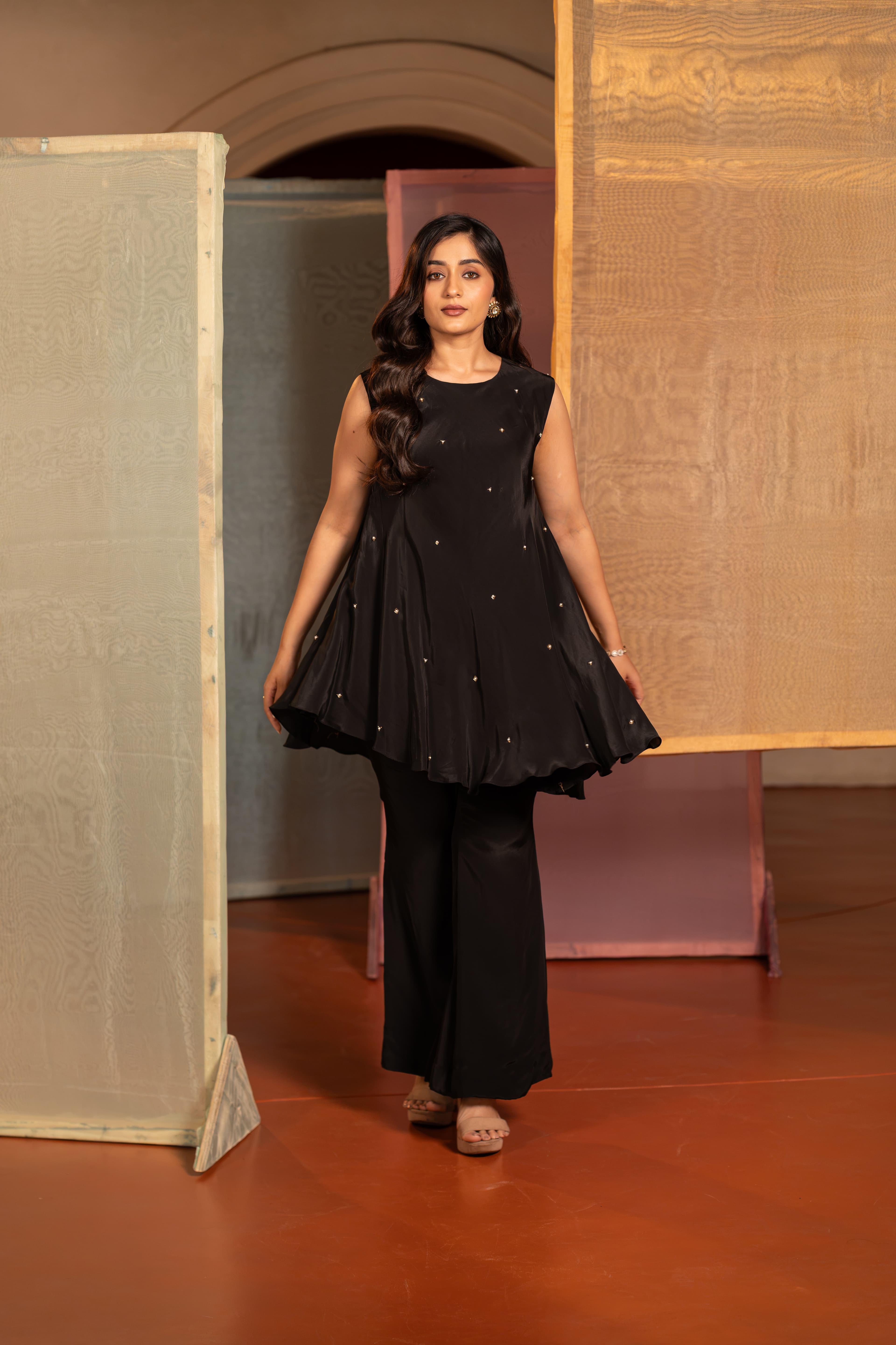 Craftsmanship detail — Black Indo Western Top and Bell Bottom Pant with Moti handwork.